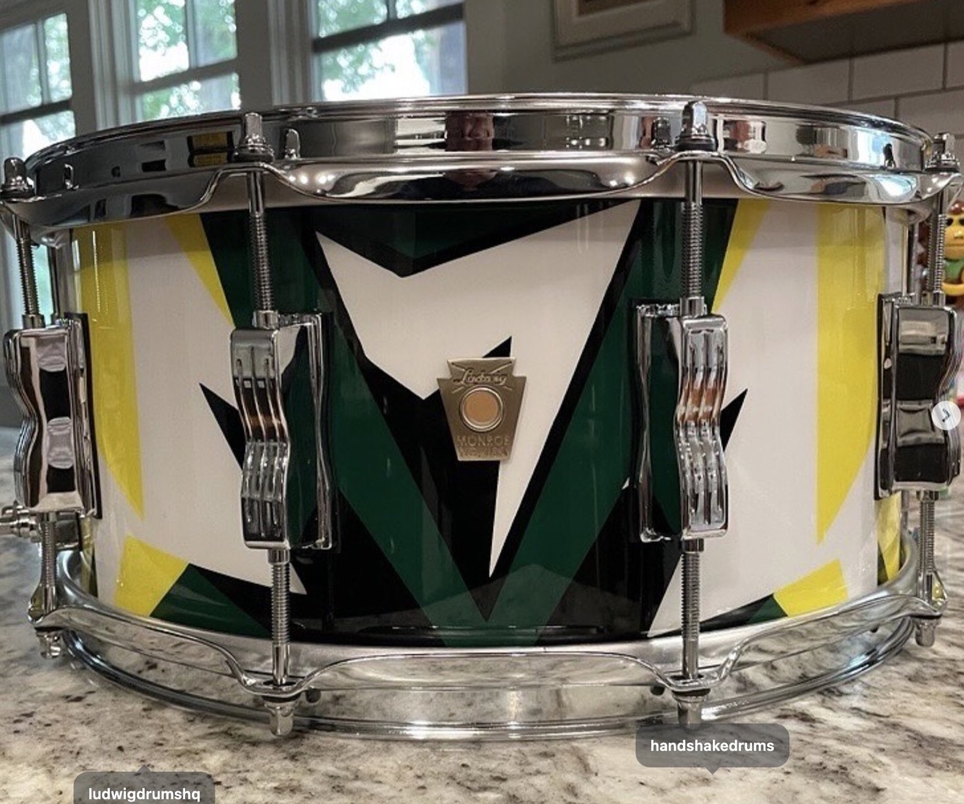A Ludwig snare painted for Tinker Hatfield in white, green, yellow and black